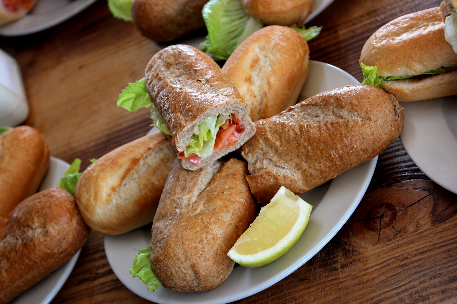 Fish sandwiches with lemon on a plate