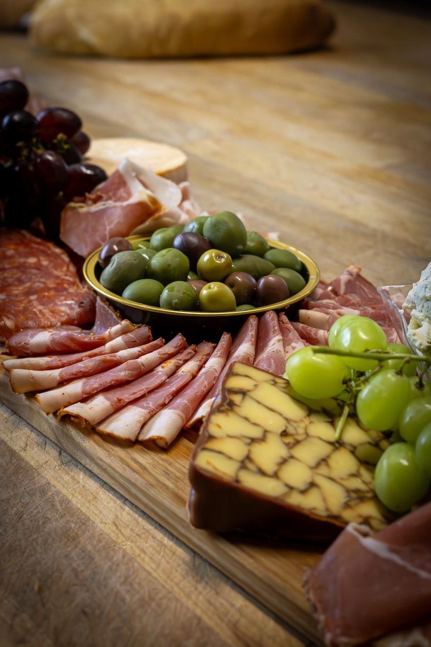 Rustic charcuterie board with wine