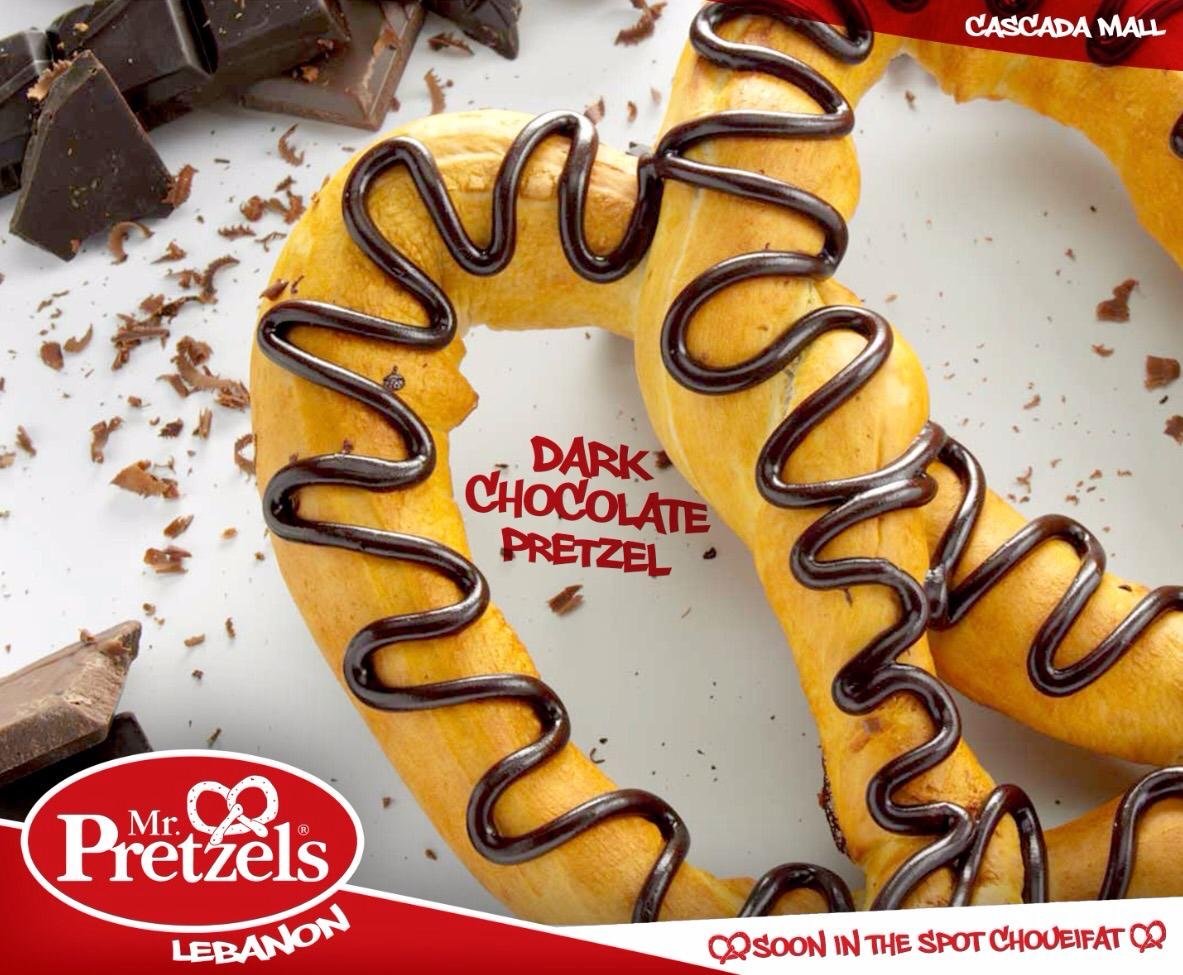 A pretzel with dark chocolate drizzle