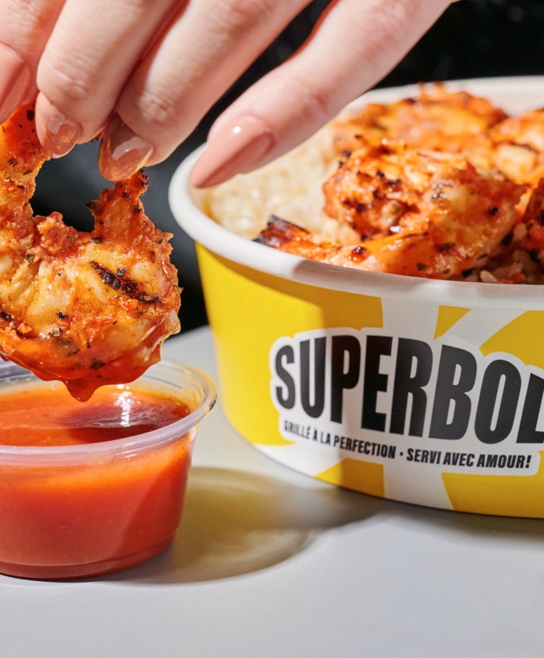 A branded Superbol food bowl with food